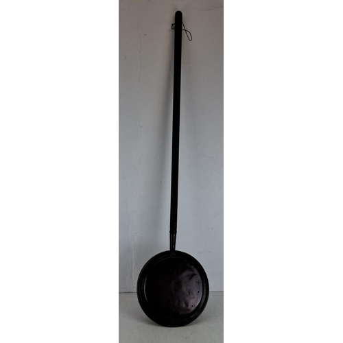 348 - Antique copper bed warmer with wooden handle, featuring a hinged lid with ventilation holes.