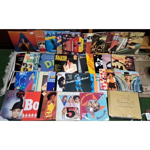397 - A lot of vintage vinyl records featuring various artists and genres. Includes notable albums from El... 