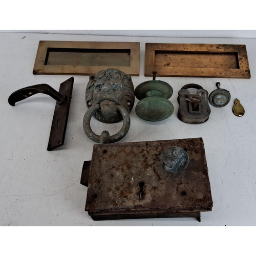 431 - Collection of antique brass and bronze door furnishings including a lion-head door knocker, letter s... 