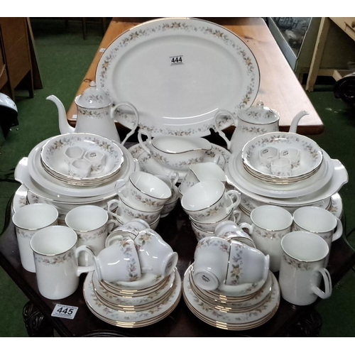 444 - Fine Bone China dinnerware set from Mayfair, Staffordshire, England. The set exhibits a floral patte... 