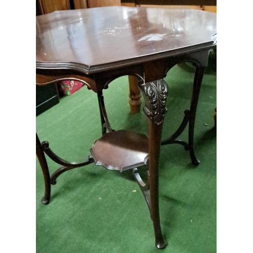 445 - Edwardian mahogany side table with octagonal top and lower shelf, featuring carved floral details on... 