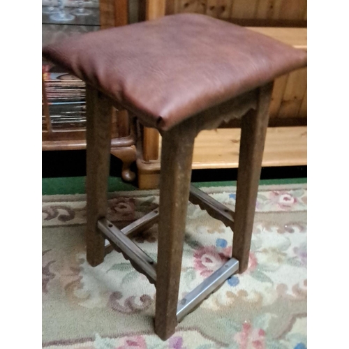 447 - Vintage wooden stool with brown upholstered seat. Features solid construction with four legs and cro... 