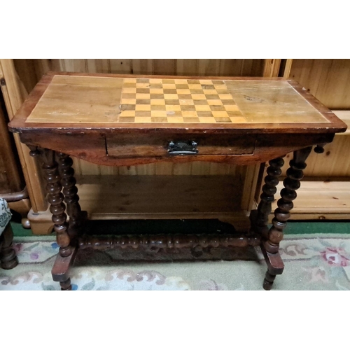 450 - Antique wooden chess table with single drawer and turned legs, featuring an inlaid checkerboard top.... 