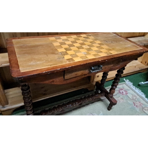 450 - Antique wooden chess table with single drawer and turned legs, featuring an inlaid checkerboard top.... 