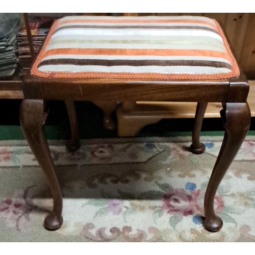 456 - Piano stool with cabriole legs and striped upholstered seat, crafted from hardwood.