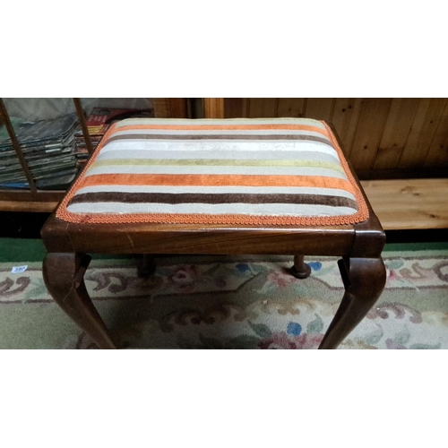 456 - Piano stool with cabriole legs and striped upholstered seat, crafted from hardwood.