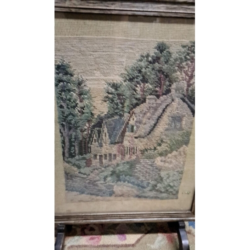 461 - Framed needlepoint scene depicting a charming cottage amidst a wooded landscape, housed in a rustic ... 