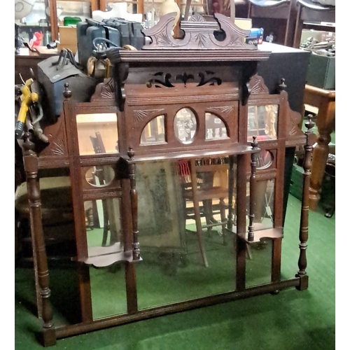 463 - Victorian walnut overmantel mirror with carved floral motifs and beveled glass inserts. It has intri... 