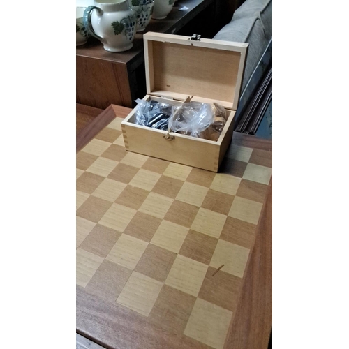 479 - Wooden chess board with inset squares. Includes a complementary storage box containing chess pieces,... 