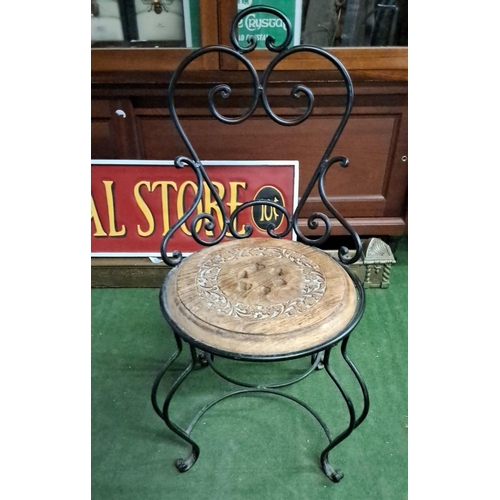 483 - Ornate wrought iron and carved wooden seat, featuring floral motifs and elegant curved backrest. Det... 