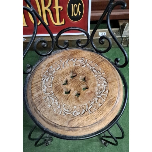 483 - Ornate wrought iron and carved wooden seat, featuring floral motifs and elegant curved backrest. Det... 