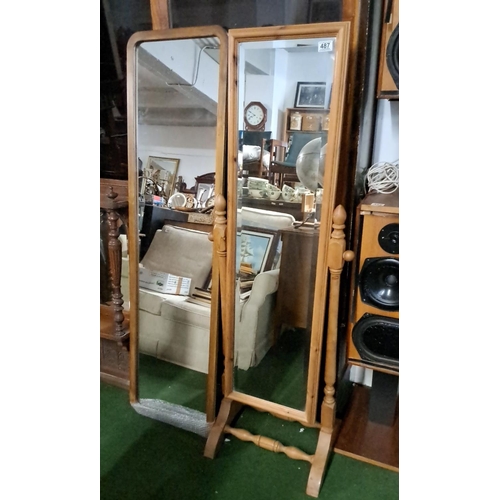 487 - Full-length wooden cheval mirror with adjustable tilting frame and turned spindle supports.