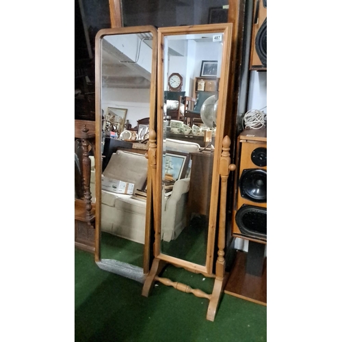 487 - Full-length wooden cheval mirror with adjustable tilting frame and turned spindle supports.