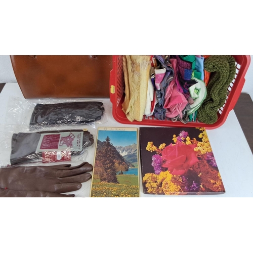 494 - Mixed lot featuring a brown leather handbag, basket with assorted scarves, two pairs of brown leathe... 