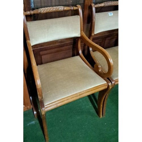 498 - Set of three oak dining chairs with curved armrests and upholstered seats and backrests, featuring i... 