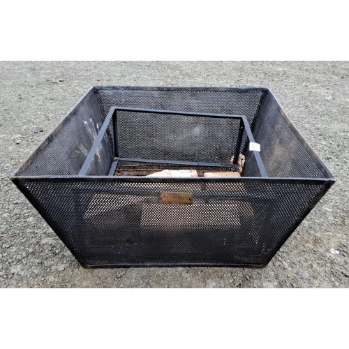 502 - Square metal fire pit with perforated steel sides. Includes a removable grate and several firebricks... 