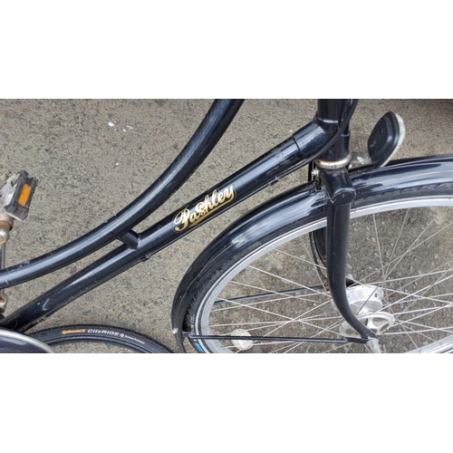 506 - Pashley classic black bicycle. Features a wicker basket and leather saddle. Includes practical rear ... 