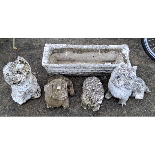 507 - Set of four cement dog garden statues and a rectangular faux stone planter box. Depicts various dog ... 