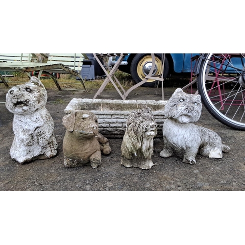 507 - Set of four cement dog garden statues and a rectangular faux stone planter box. Depicts various dog ... 