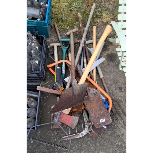 511 - Mixed lot of assorted gardening and farm tools. Includes shovels, rakes, hoes, and handles. Comes in... 