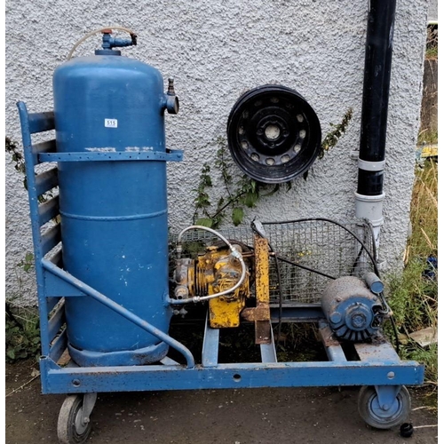 515 - Industrial air compressor with attached receiver tank and pump, mounted on wheeled frame. Featuring ... 