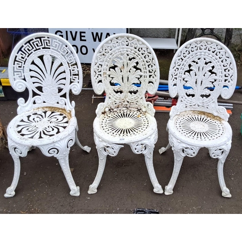 529 - Set of three vintage white cast aluminium garden chairs with intricate floral and geometric patterns... 