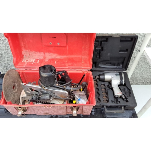 533 - Two toolboxes with a variety of tools. Includes an electric circular saw, drill, and accessories. On... 