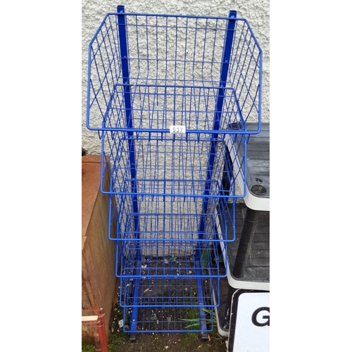 537 - Blue four-tier wire storage rack on wheels. This rack is made of sturdy metal wire with a bright blu... 