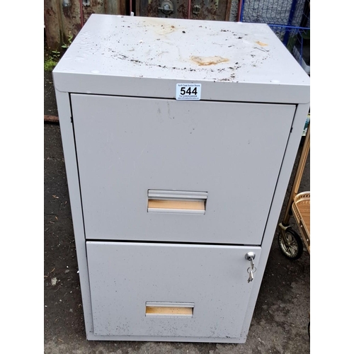 544 - Two-drawer metal filing cabinet with keys. The cabinet is grey. Contains various file folders. 66x40... 