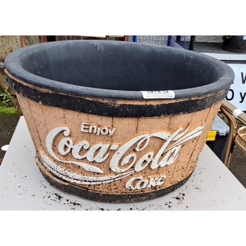 545 - Vintage Coca-Cola themed planter, featuring iconic branding, approximately 30 inches in diameter. Th... 