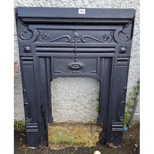 550 - Cast iron fireplace surround featuring ornate floral and vine detailing. 75x102cm.