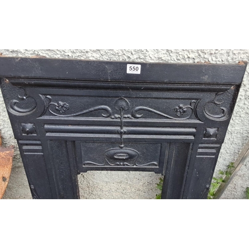 550 - Cast iron fireplace surround featuring ornate floral and vine detailing. 75x102cm.