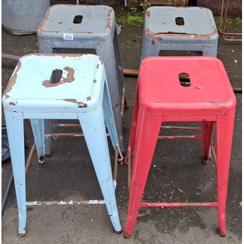 552 - Set of four vintage metal stools in assorted colors: two gray, one light blue, and one red.