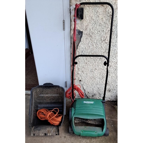 562 - Qualcast Bosch Engineering electric lawn mower with collection box and orange extension cord.