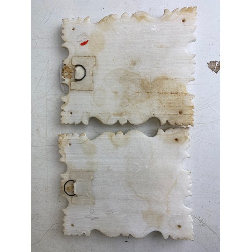 123 - Pair of religious icons in white marble frames with gold detailing, featuring portraits of the Sacre... 