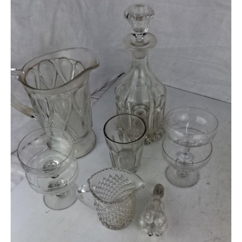 28 - Collection includes a clear glass pitcher, decanter with stopper, two goblets, one tumbler, and one ... 