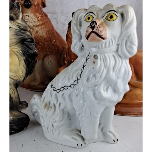 49 - A collection of six antique/vintage chalk and ceramic animal figurines including lions, cats & dogs.