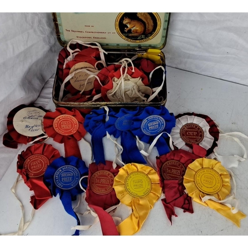 66 - The collection includes vintage local Agricultural prize ribbons of various colours. These ribbons a... 