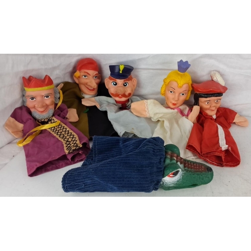 74 - Set of six vintage hand puppets featuring various characters including royalty, law enforcement, and... 