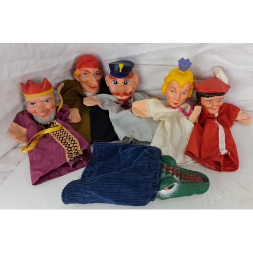 74 - Set of six vintage hand puppets featuring various characters including royalty, law enforcement, and... 