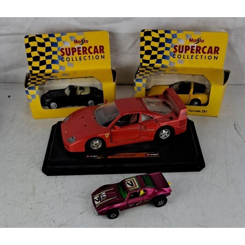 94 - Four die-cast model cars. It comprises a Burago Ferrari F40 (1987), and three Maisto Supercar Collec... 