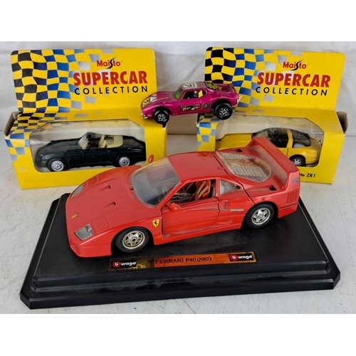 94 - Four die-cast model cars. It comprises a Burago Ferrari F40 (1987), and three Maisto Supercar Collec... 