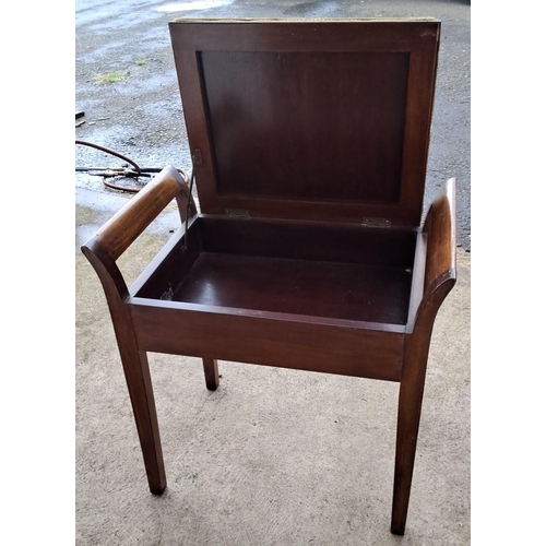 97 - Edwardian mahogany piano stool with upholstered green fabric seat. It has an under-seat storage comp... 