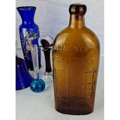 105 - A collection of vintage and antique glass bottles and vases. The collection features a variety of co... 