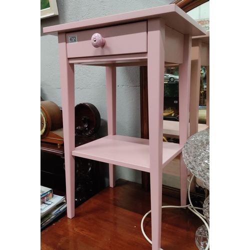 472 - Pink wooden side table with a single drawer, an ornate knob, and a lower shelf.