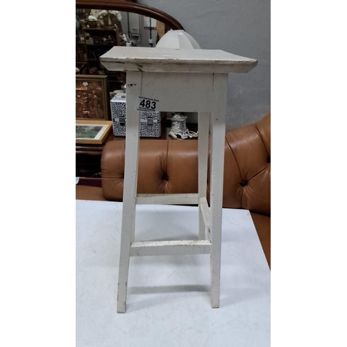 483 - Vintage white-painted wooden stool, featuring a distressed finish and four sturdy legs with crossbar... 