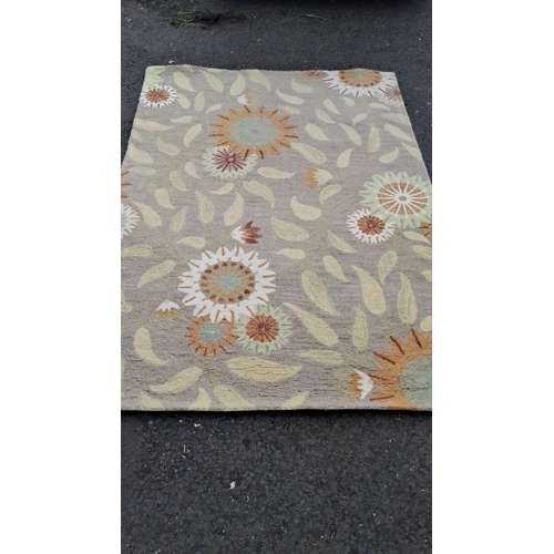 494 - Hand-woven wool rug, featuring a ''Rainbow Flowers'' design. Dimensions are 160 x 230 cm. Certified ... 