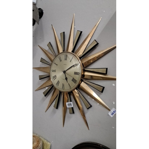 498 - The Metamec Sunburst Wall Clock features a quartz movement with Roman numeral hour markers. This ite... 