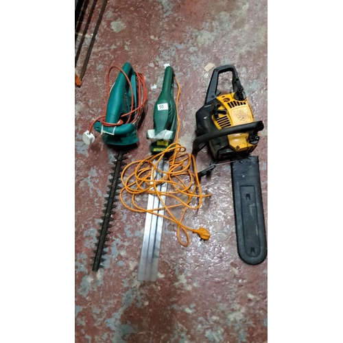 503 - The lot includes a Bosch AHS 480-16 hedge trimmer, a McCulloch Mac 436 chainsaw, and an electric gra... 