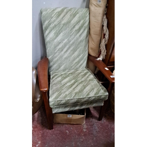 505 - Mid-Century Modern armchair with green patterned upholstery and solid wooden armrests. Condition is ... 